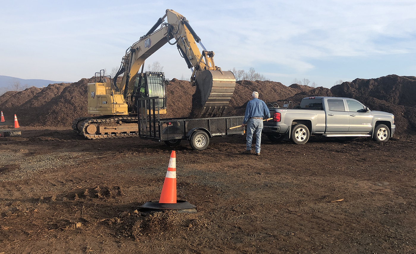 A truck is loaded with mulch