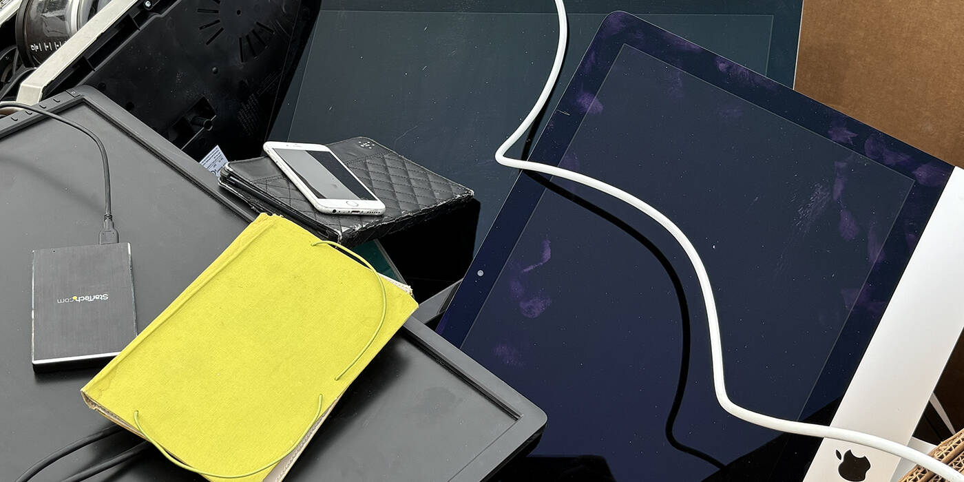 Computers, cell phones, and tablets wait to be recycled